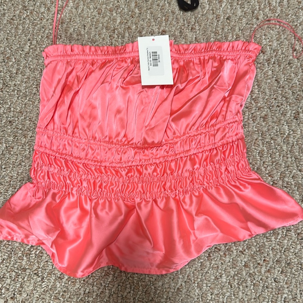Boutique Pretty pink silk like strapless tube top.